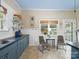 Eat-in kitchen with bright natural light, a cozy breakfast nook, and floating shelves at 253 Misenheimer Nw Dr, Concord, NC 28025