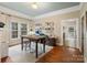 Spacious living room with hardwood floors, a decorative fireplace, and large windows providing ample light at 253 Misenheimer Nw Dr, Concord, NC 28025