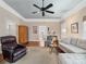 Open living room with hardwood floors, neutral decor, a comfortable sofa, and ample seating at 253 Misenheimer Nw Dr, Concord, NC 28025
