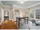 Open-concept living room with hardwood floors, a fireplace, and ample natural light at 253 Misenheimer Nw Dr, Concord, NC 28025