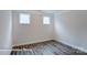 Well-lit bedroom with hardwood floors and dual windows at 3009 Bent Willow Dr # 160, Indian Trail, NC 28079