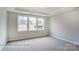 Bright bedroom with large windows and plush carpeting at 3009 Bent Willow Dr # 160, Indian Trail, NC 28079