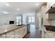 Open kitchen featuring oversized island with granite counters and stainless steel appliances, open to living space at 3009 Bent Willow Dr # 160, Indian Trail, NC 28079