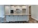 Gourmet kitchen featuring oversized island with granite counters and modern stainless steel appliances at 3009 Bent Willow Dr # 160, Indian Trail, NC 28079