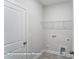 Convenient laundry room includes washer/dryer hookups and storage shelf at 3009 Bent Willow Dr # 160, Indian Trail, NC 28079