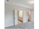 Carpeted Main Bedroom with a view into the bathroom and closets at 3009 Bent Willow Dr # 160, Indian Trail, NC 28079