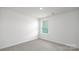 A bright bedroom has carpeted floors and a window with natural light at 327 Brinkley Dr # 107, Kings Mountain, NC 28086