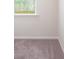 Bright bedroom featuring neutral-toned carpet, white walls, and a window with natural light at 327 Brinkley Dr # 107, Kings Mountain, NC 28086