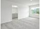 Carpeted bedroom features a window, bathroom access, and white walls at 327 Brinkley Dr # 107, Kings Mountain, NC 28086