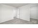 A bright bedroom has carpeted floors, neutral walls and a closet at 327 Brinkley Dr # 107, Kings Mountain, NC 28086
