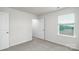 A bright bedroom has carpeted floors and a window with natural light at 327 Brinkley Dr # 107, Kings Mountain, NC 28086