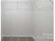 This closet features carpeted flooring and a wire shelf with hanging rod at 327 Brinkley Dr # 107, Kings Mountain, NC 28086