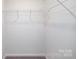 This closet features carpeted flooring and a wire shelf with hanging rod at 327 Brinkley Dr # 107, Kings Mountain, NC 28086