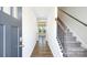 Inviting entryway with hardwood floors and staircase leading to the upper level at 327 Brinkley Dr # 107, Kings Mountain, NC 28086