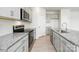 Close-up of kitchen featuring stainless steel oven and gray cabinets at 327 Brinkley Dr, Kings Mountain, NC 28086