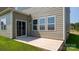 Concrete patio with sliding glass door to the house, seamlessly blending indoor and outdoor living at 327 Brinkley Dr # 107, Kings Mountain, NC 28086