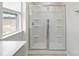 Glass enclosed shower stall featuring built in shelving to help keep bathroom products organized at 327 Brinkley Dr # 107, Kings Mountain, NC 28086