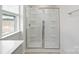Modern shower with glass doors and built-in shelving at 327 Brinkley Dr # 107, Kings Mountain, NC 28086