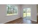 Bright sun room with hardwood floors, large windows and sliding doors at 327 Brinkley Dr # 107, Kings Mountain, NC 28086
