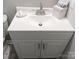 Modern vanity with a white countertop, sleek faucet, and storage space at 3240 Heathstead Pl, Charlotte, NC 28210