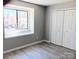 Bright bedroom with a window and closet space, freshly painted with a modern, neutral color at 3240 Heathstead Pl, Charlotte, NC 28210