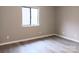 Neutral bedroom with a window and modern floors and fresh, neutral paint throughout at 3240 Heathstead Pl, Charlotte, NC 28210