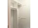 All-white, tidy closet featuring built-in shelving and ample hanging space for optimal storage at 3240 Heathstead Pl, Charlotte, NC 28210