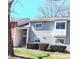Exterior of a lovely gray home with neat shrubbery, a bay window, and staircase leading to the front door at 3240 Heathstead Pl, Charlotte, NC 28210
