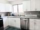 Bright kitchen features stainless steel appliances, white cabinetry, and granite countertops at 3240 Heathstead Pl, Charlotte, NC 28210
