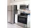 Stainless steel refrigerator and stove in the kitchen of this home at 3240 Heathstead Pl, Charlotte, NC 28210