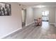 The spacious open-concept living room features modern flooring and neutral wall paint throughout at 3240 Heathstead Pl, Charlotte, NC 28210
