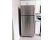 Kitchen features a stainless steel refrigerator next to range and cabinets at 3240 Heathstead Pl, Charlotte, NC 28210