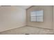A carpeted bedroom with a neutral color scheme and a window providing natural light at 339 Brinkley Dr, Kings Mountain, NC 28086