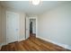 Bedroom with ample natural light, closet, and fresh paint at 418 N Pear St, Gastonia, NC 28054