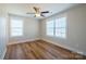 Bedroom features ceiling fan, large window, and laminate flooring at 418 N Pear St, Gastonia, NC 28054