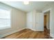 Bedroom with ample natural light, closet, and fresh paint at 418 N Pear St, Gastonia, NC 28054