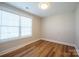 Bedroom featuring a large window and durable laminate flooring at 418 N Pear St, Gastonia, NC 28054