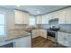 Well-lit kitchen showcases granite countertops, stainless steel appliances, and white cabinetry at 418 N Pear St, Gastonia, NC 28054