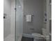 Modern bathroom featuring a glass enclosed shower with tile walls and a built in shelving unit at 435 Beacon Nw St, Concord, NC 28027