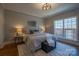 Comfortable bedroom with natural light, a stylish bed, and a cozy rug at 435 Beacon Nw St, Concord, NC 28027