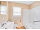 This bathroom features a sink, toilet, and shower-tub combo with grab bar at 712 Stevens St, Gastonia, NC 28054