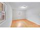 Cozy bedroom features hardwood flooring and a window offering a serene living space at 712 Stevens St, Gastonia, NC 28054