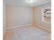 Neutral bedroom with carpet and a window offers a comfortable and serene living space at 712 Stevens St, Gastonia, NC 28054