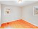 This bedroom features hardwood floors and two windows that provide natural light at 712 Stevens St, Gastonia, NC 28054