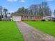 A beautiful house with a driveway and green front yard at 712 Stevens St, Gastonia, NC 28054