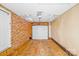 This garage has concrete floors, white garage door, and a pedestrian door to the exterior at 712 Stevens St, Gastonia, NC 28054