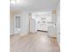 Bright kitchen featuring white appliances and cabinetry with a view into the living area at 712 Stevens St, Gastonia, NC 28054