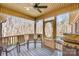 Cozy screened-in back porch featuring outdoor seating and a grill with wooded views at 809 Liberty Rd, Gold Hill, NC 28071