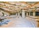 Exposed crawlspace under the home with support beams, insulation, and concrete pad at 809 Liberty Rd, Gold Hill, NC 28071