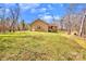Back exterior elevation of a brick home with a large yard at 809 Liberty Rd, Gold Hill, NC 28071